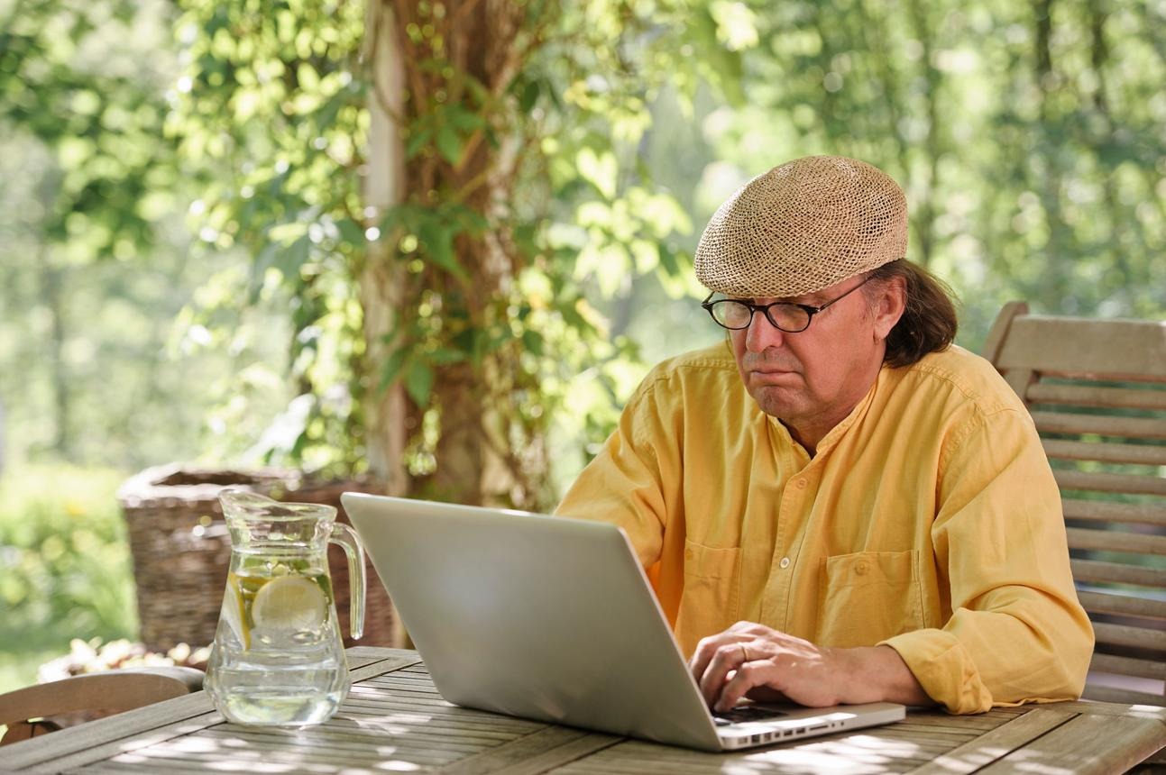 Man outside on a laptop